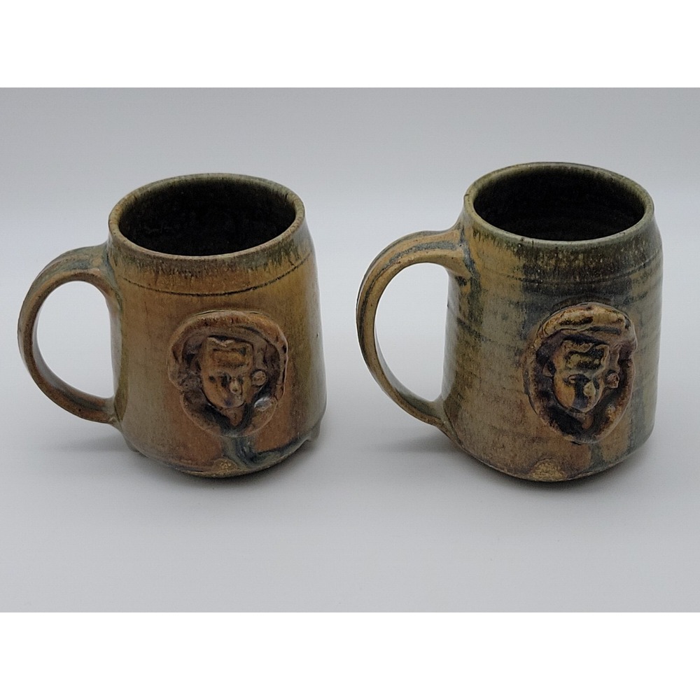 2 Art Pottery Mug with Embosed Cherub Face -Marked Lansing